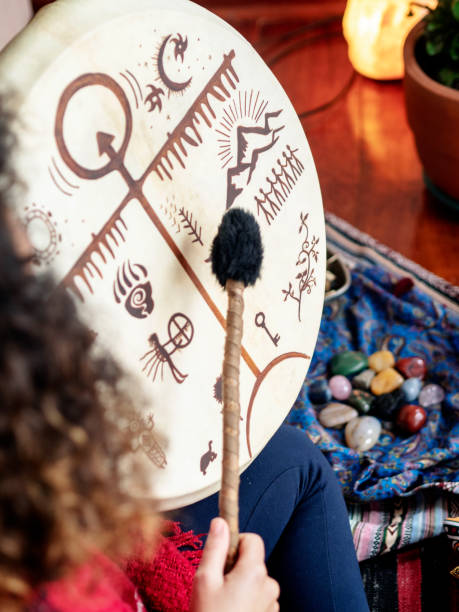 istock shaman woman playing Shamanic drum 1221900319