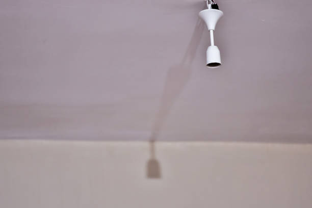 istock Bulb holder hanging on the ceiling. Empty is not plugged in. 1221902348