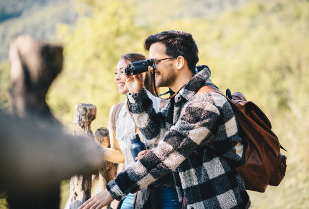 istock Couple happily looking far away into the beautiful nature. 1221903615