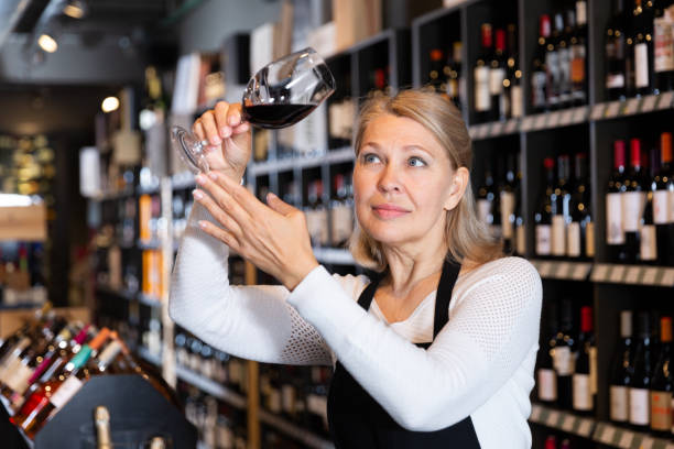 istock Woman sommelier tasting wines in winery 1221903814