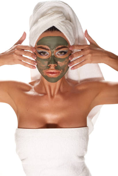 istock beautiful woman with red lipstick and a mask 1221904656