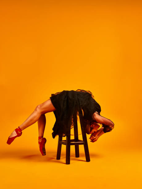 istock Ballet dancer or classic ballerina dancing isolated on yellow background. The dance, grace, artist, contemporary, movement, action and motion concept 1221904821