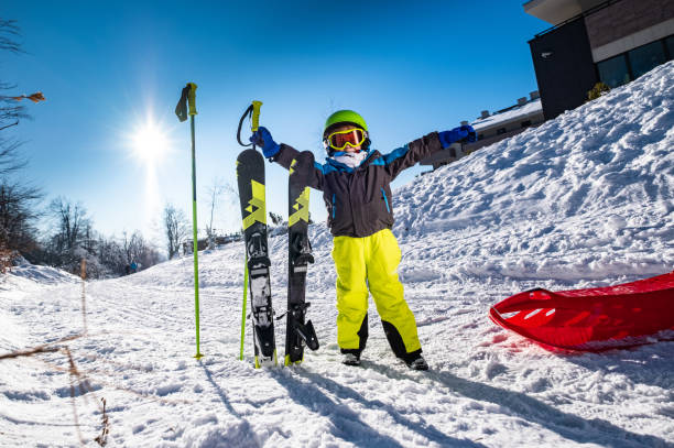 istock Little boy with ski equipment 1221905573