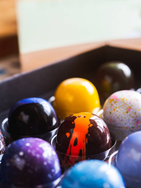 istock Box of artisanal chocolate on wooden table 1221910892