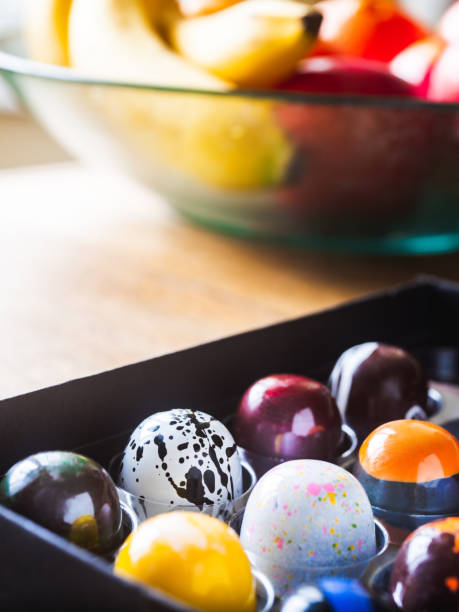 istock Box of artisanal chocolate on wooden table 1221910908