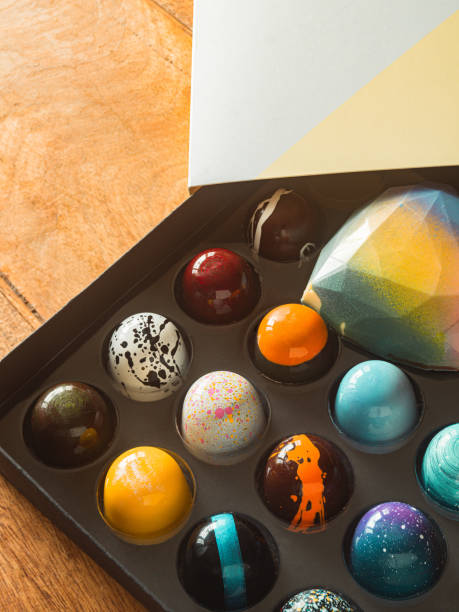 istock Box of artisanal chocolate on wooden table 1221912499