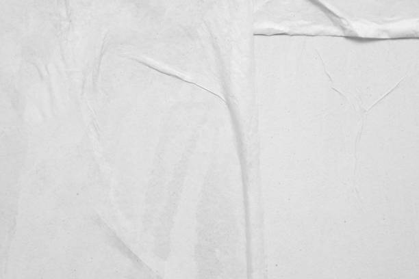 istock Blank white crumpled and creased paper poster texture background 1221913886