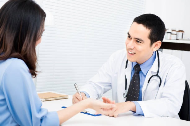 istock Doctor asking some information from female patient 1221913977