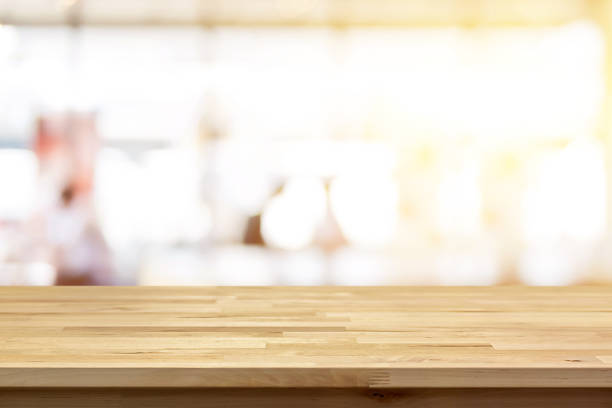 istock Wood table top on blur restaurant interior background 1221913993