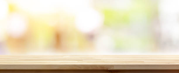 istock Wood table top on abstract bokeh banner background 1221914000