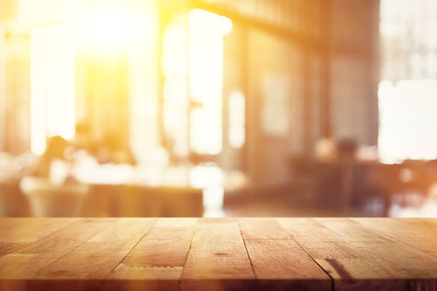 istock Wood table top on blur restaurant (cafe) interior background 1221914002