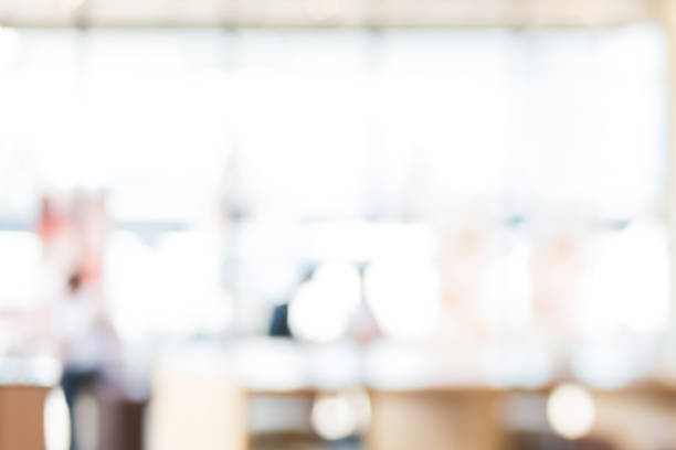 istock Abstract blur white bokeh background  from cafe interior 1221914004