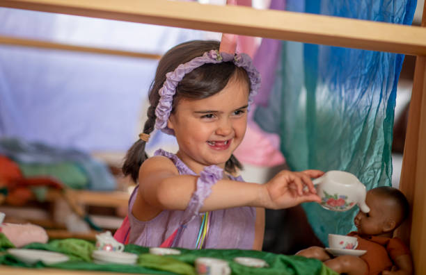 istock Cute little girl has a tea party 1221915468
