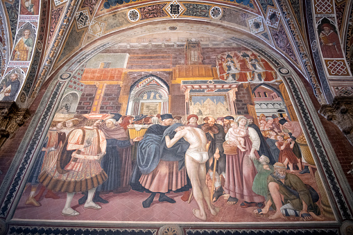 Siena, Italy - May 14, 2018. Fresco inside the ancient hospital of Santa Mario Della Scala in Siena, Italy.