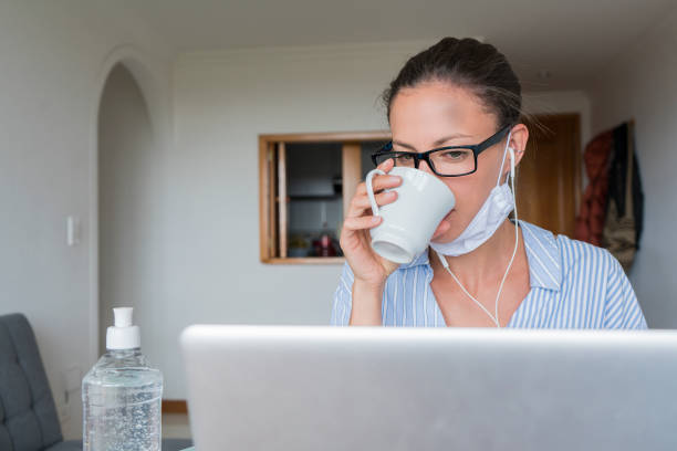 istock Woman working at home in quarantine for COVID-19 1221919716