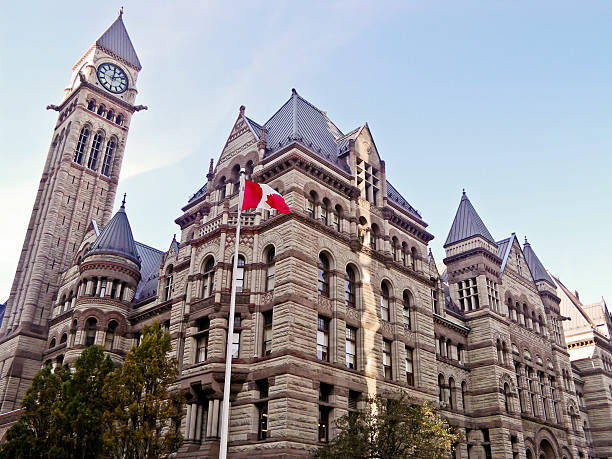 A building in Toronto with the Canadian flag out front stock photo