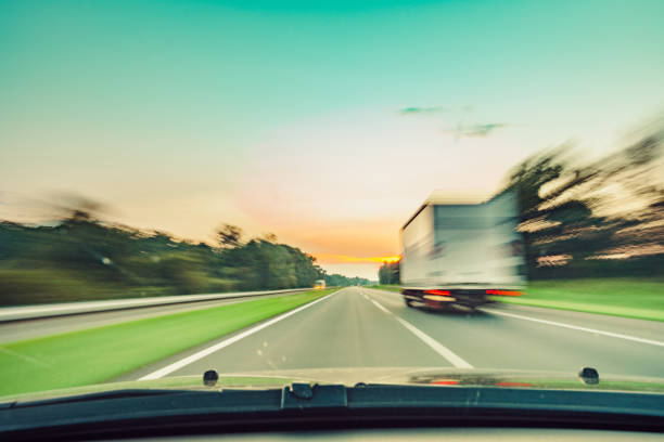 istock driving car on highway road 1221921772