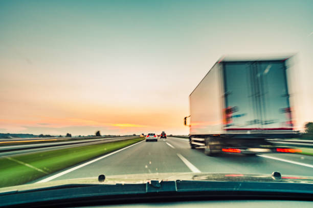 istock driving car on highway road 1221921799