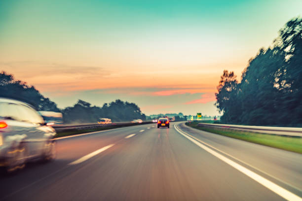 istock driving car on highway road 1221921878