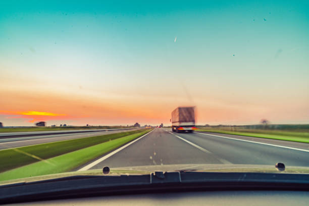 istock driving car on highway road 1221922887
