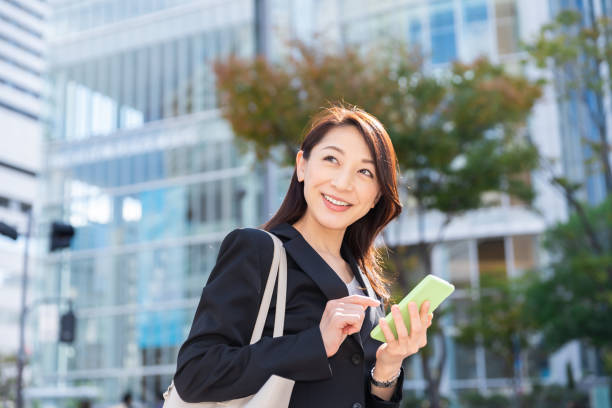 istock asian woman who see a smart phone 1221922932