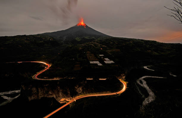 Tungurahua volcano, ecuador Tungurahua,  5,023 meters (16,480 ft) is located in the Cordillera Oriental of the Andes of central Ecuador according to one theory the name Tungurahua is a combination of the Quichua tunguri (throat) and rahua (fire) meaning "Throat of Fire". According to another theory it is based on the Quichua uraua for crater.  Tungurahua is also known as "The Black Giant" and, in local indigenous mythology it is allegedly referred to as Mama Tungurahua ("Mother Tungurahua"). mt tungurahua sunset mountain volcano stock pictures, royalty-free photos & images