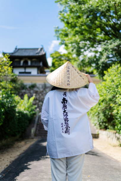 Japanese Buddhist traveling in Shikoku Japanese Buddhist traveling in Shikoku shingon buddhism stock pictures, royalty-free photos & images