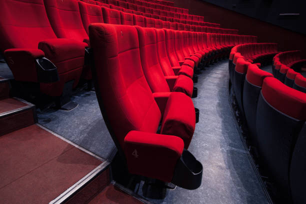 istock Cinema auditorium with one reserved seat 1221934247