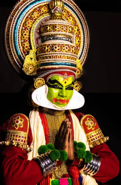 Photo of Kathakali kerala classical dance men greeting posture look towards you