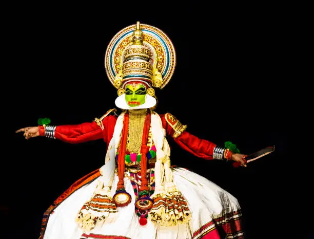 This image is the posture and facial expression of famous indian classical dance kathakali. which is performed at south indian state of kerala.