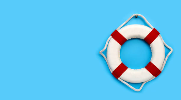 istock Lifebuoy on blue background. Copy space 1221939429