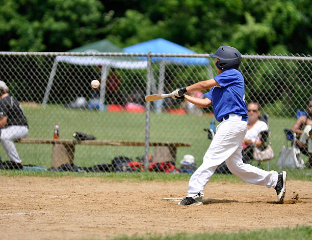 youth league baseball player Little league baseball player batting youth baseball and softball league photos stock pictures, royalty-free photos & images