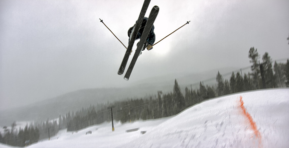 A Skier in Full Winter Gear Attempting a \
