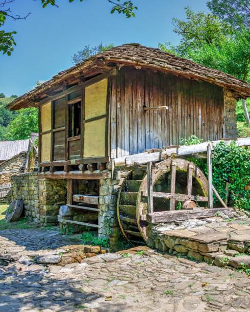 Valldemossa, Mallorca, May 2023: Olive oil grinding wheel in the ruins of a hermitage near the town of Valldemossa.