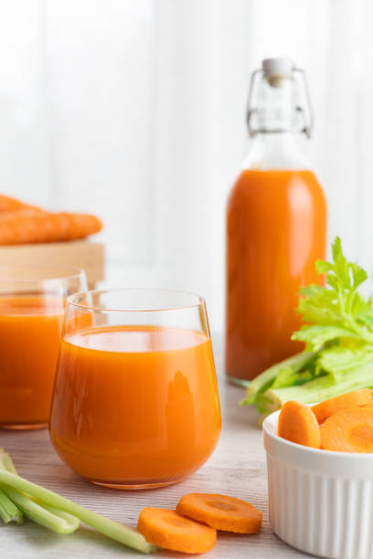 istock Glass with carrot juice and celery. 1221945621