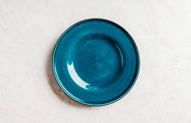 istock Clean blue plate on the rustic background. Selective focus. Shot from above. 1221946624