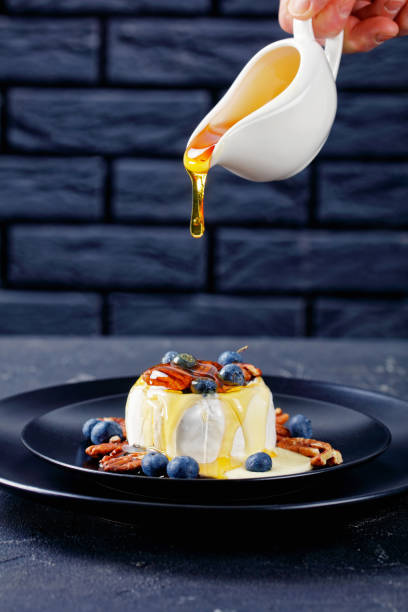 istock Raw american brie cheese with blueberries and pecans 1221947848
