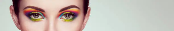 Photo of Female eye with  rainbow make-up