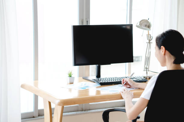 istock Young business woman working from home 1221949920