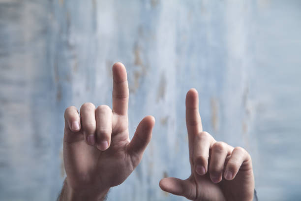 istock Male hands pointing or touching fingers in screen. 1221951432