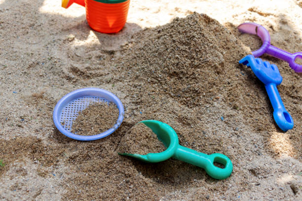 istock Sandbox with colorful tools for children 1221951450