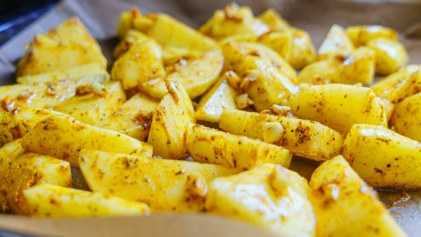 istock Selective focus. Raw potatoes chopped into small pieces.Chopped potato background, Space for text. Cooking concept. 1221954041