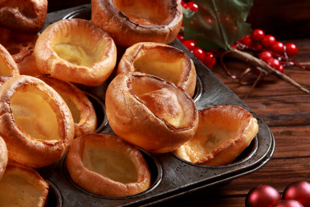 Yorkshire Pudding Freshly baked Yorkshire Puddings to join a roast dinner. A classical and traditional use for main course lunch or dinner serving. Derived from English Cuisine muffin tin eggs stock pictures, royalty-free photos & images