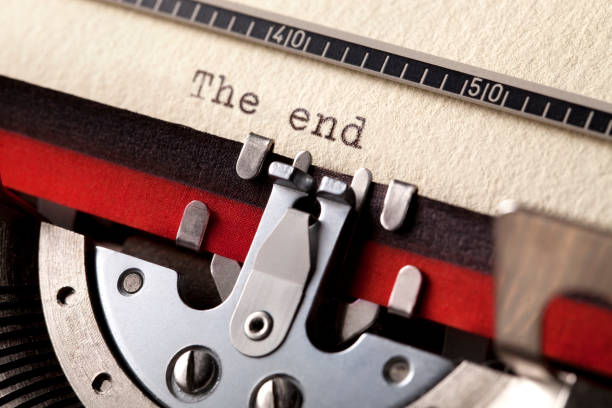 The end written with a typewriter Close-up on a typewriter. typewriter keyboard communication text office stock pictures, royalty-free photos & images