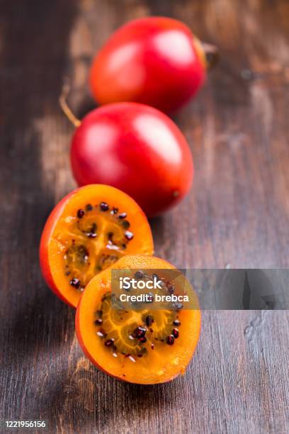 Fresh Tamarillo Fruit On Wooden Background Stock Photo - Download Image Now - Antioxidant, Food, Food and Drink