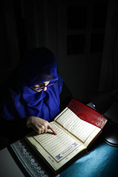 istock Woman is reading Quran in Ramadan. 1221958401