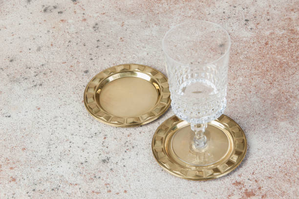 istock Antique brass coasters, small dish on concrete background. 1221958549