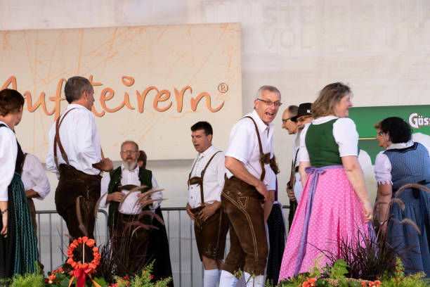 Folk dances of Styrian men and women Graz/Austria - September 2019: annual autumn festival of Styrian folk culture (Aufsteirern). Folk dances of Styrian men and women in bright traditional dresses. dirndl traditional clothing austria traditional culture stock pictures, royalty-free photos & images