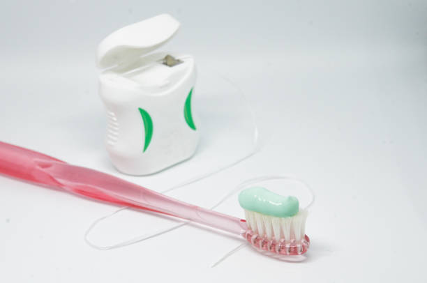 istock toothbrush and dental floss 1221967514
