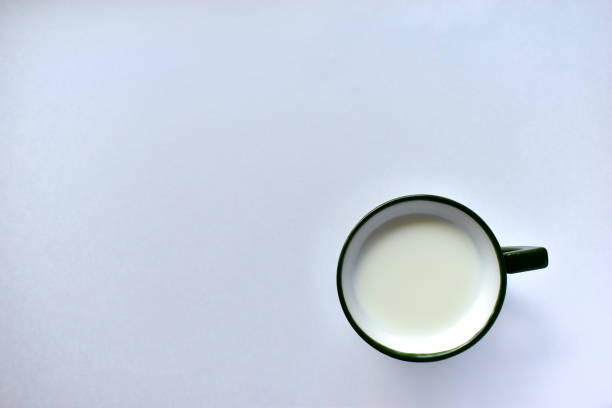 istock Green Cup with milk on a white background. 1221968046